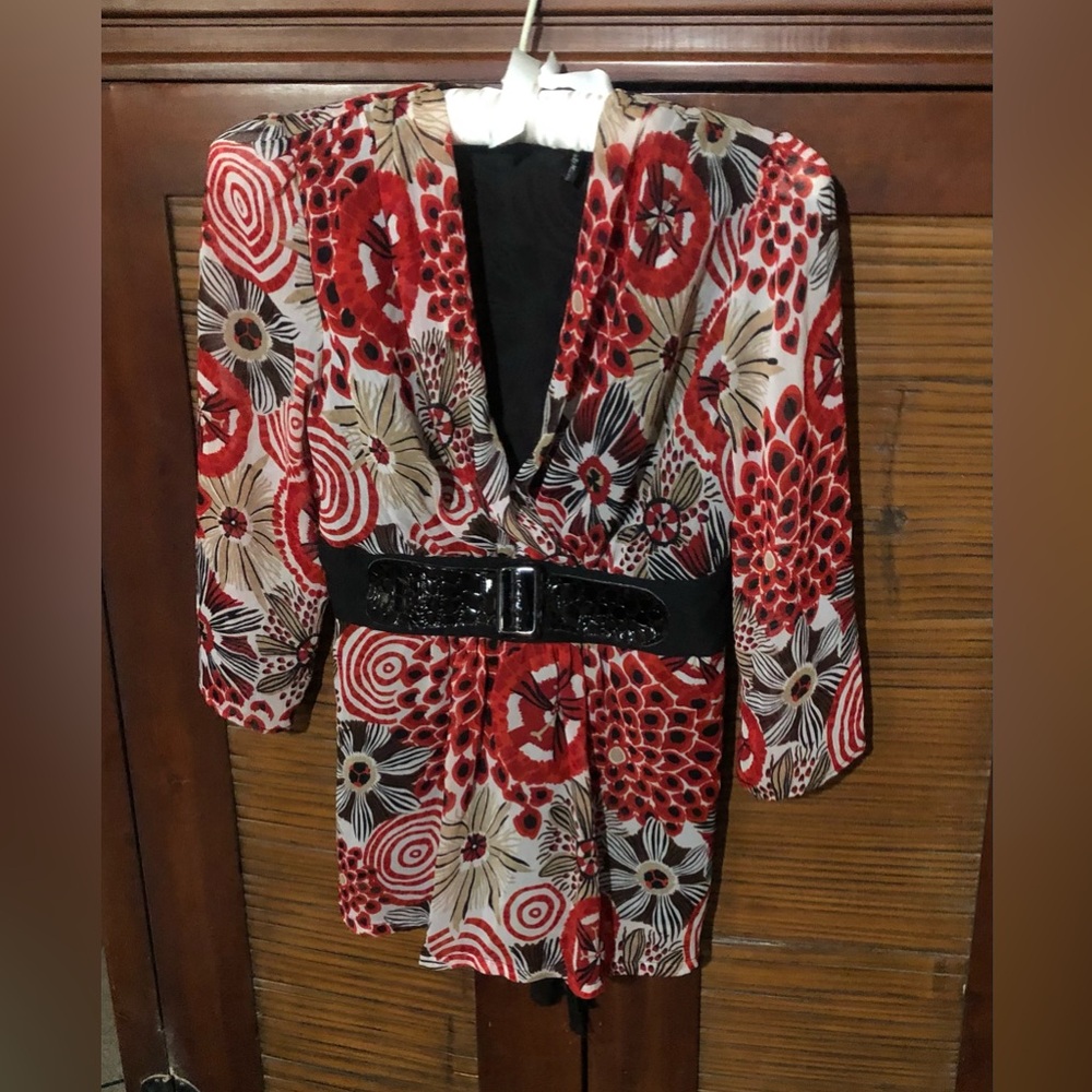 Dressy blouse looks pretty with black slacks.